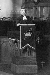 Rev. Gustav Koch at the pulpit.